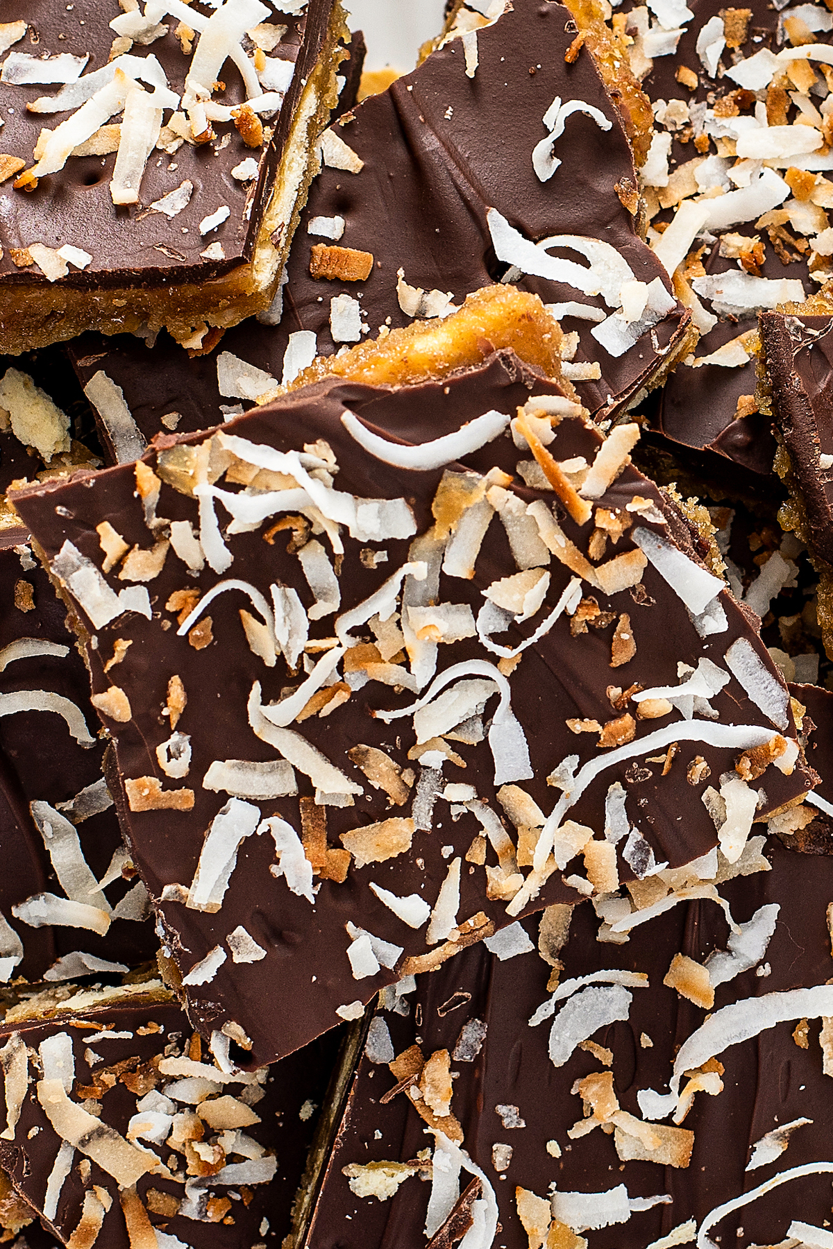Coconut flakes on top of chocolate saltine cracker toffee.