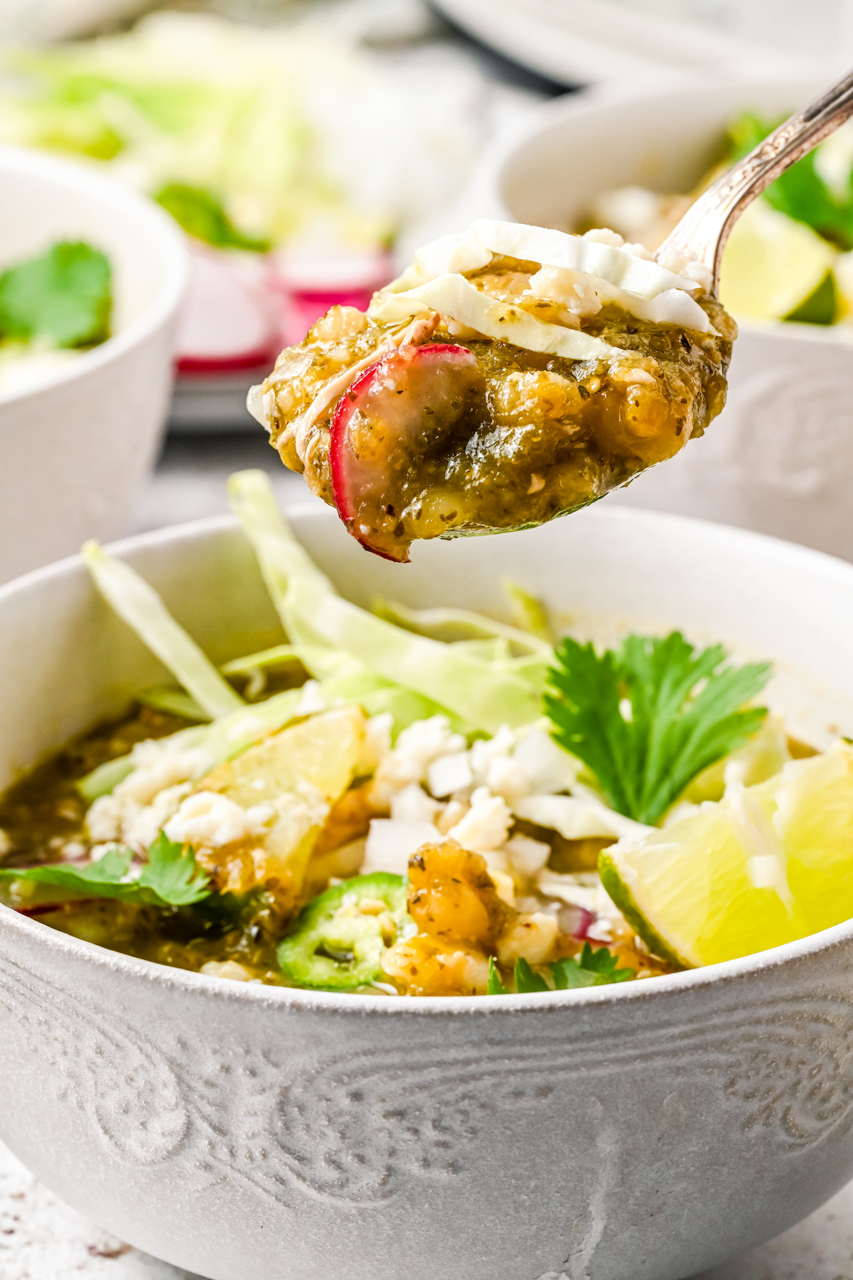 Spoonful of Mexican pozole.