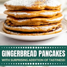 Gingerbread pancakes on a plate with powdered sugar on top.