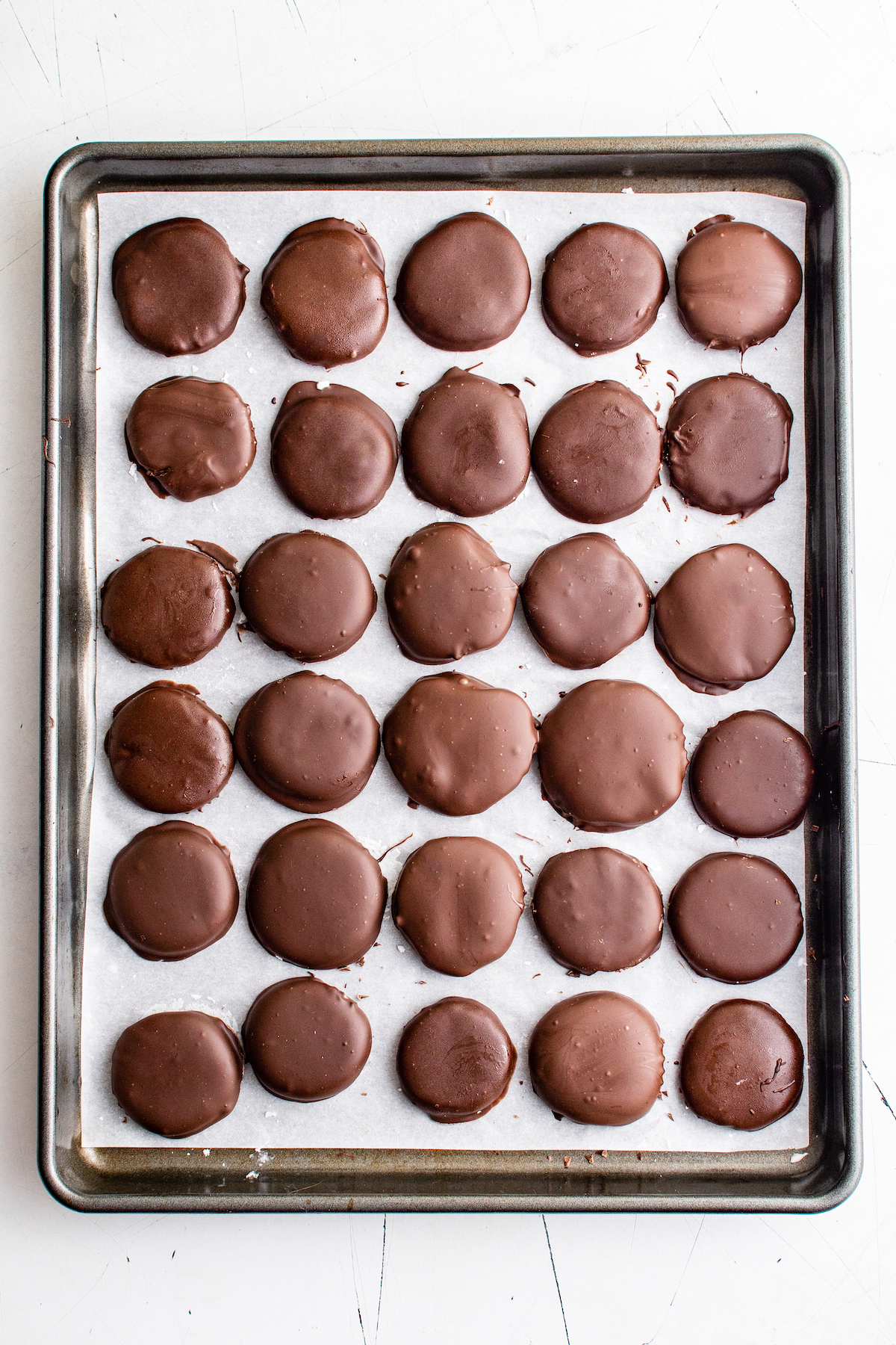 A tray of chocolate-dipped peppermint candies.