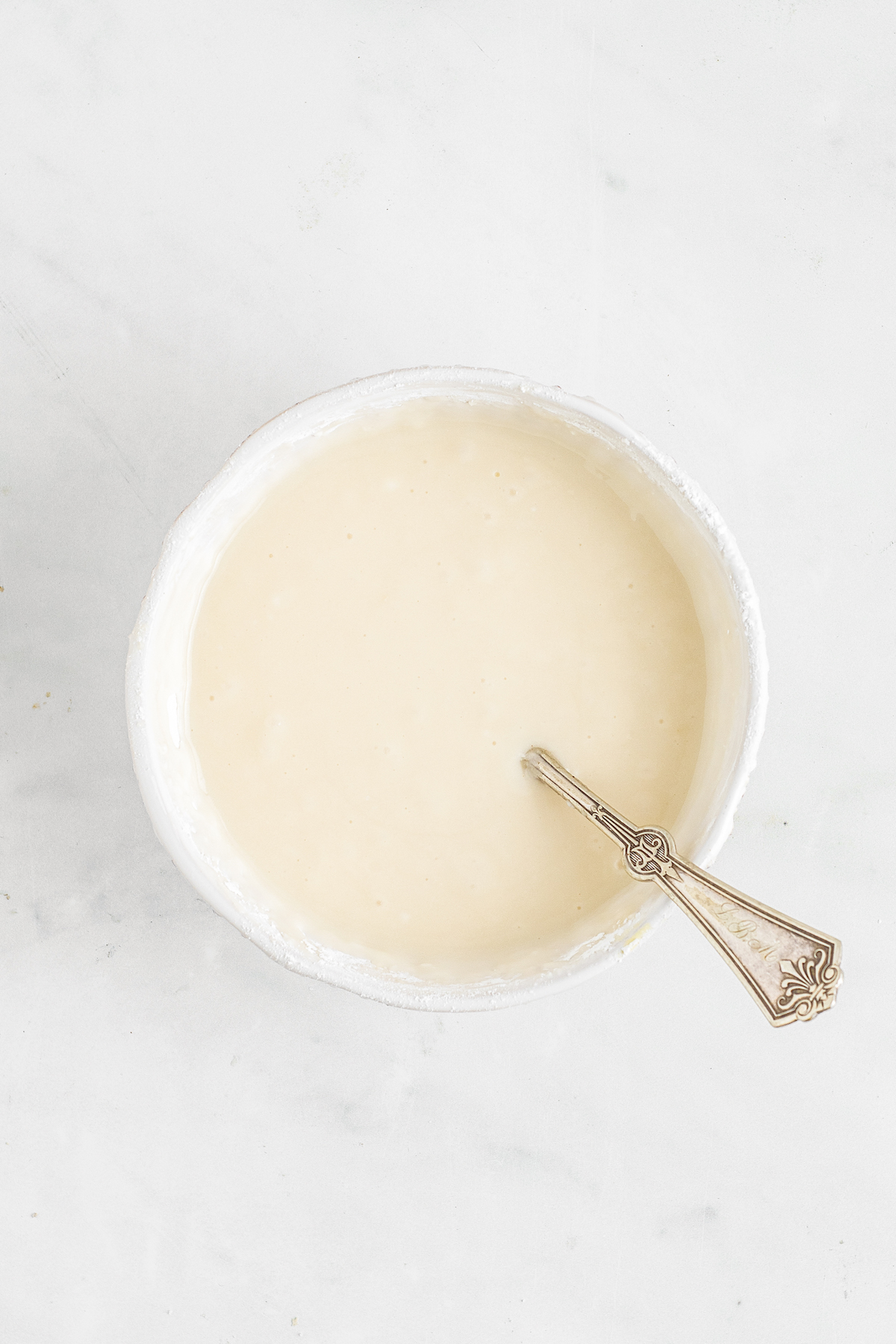 Creamy glaze in a bowl.