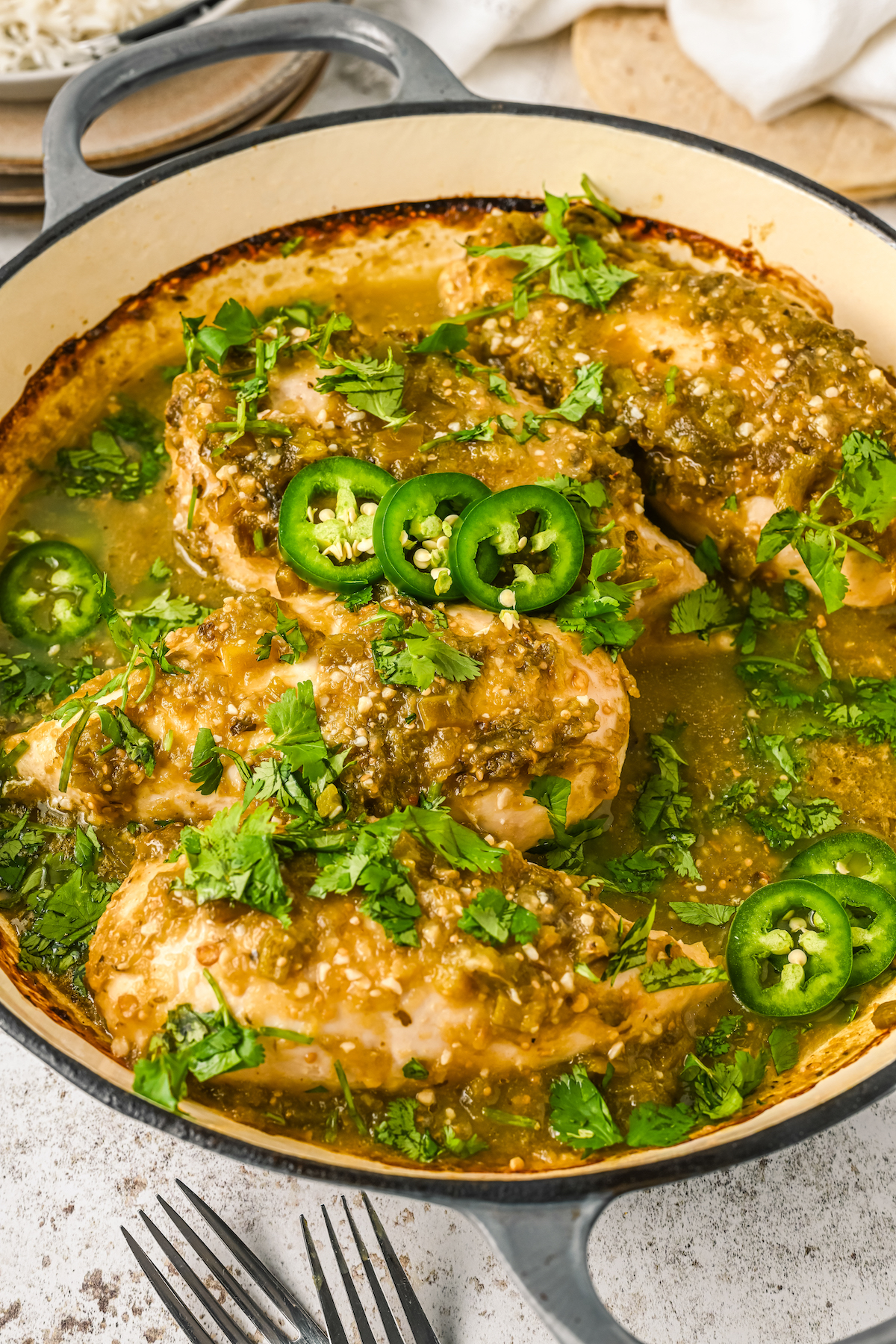 Easy salsa verde with cilantro and jalapeños in a pan.