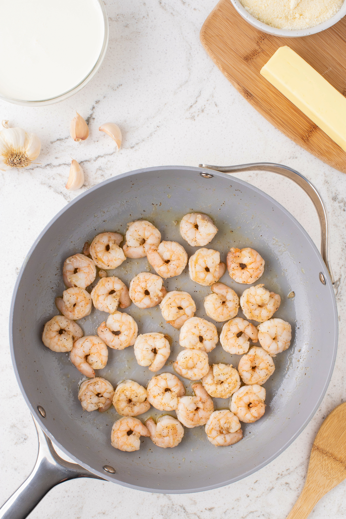 Cooked shrimp in a skillet.