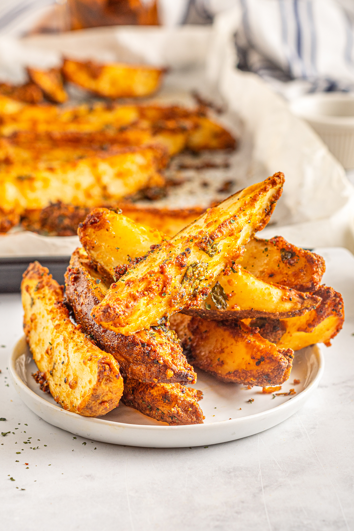 Potato wedges on a small plate.