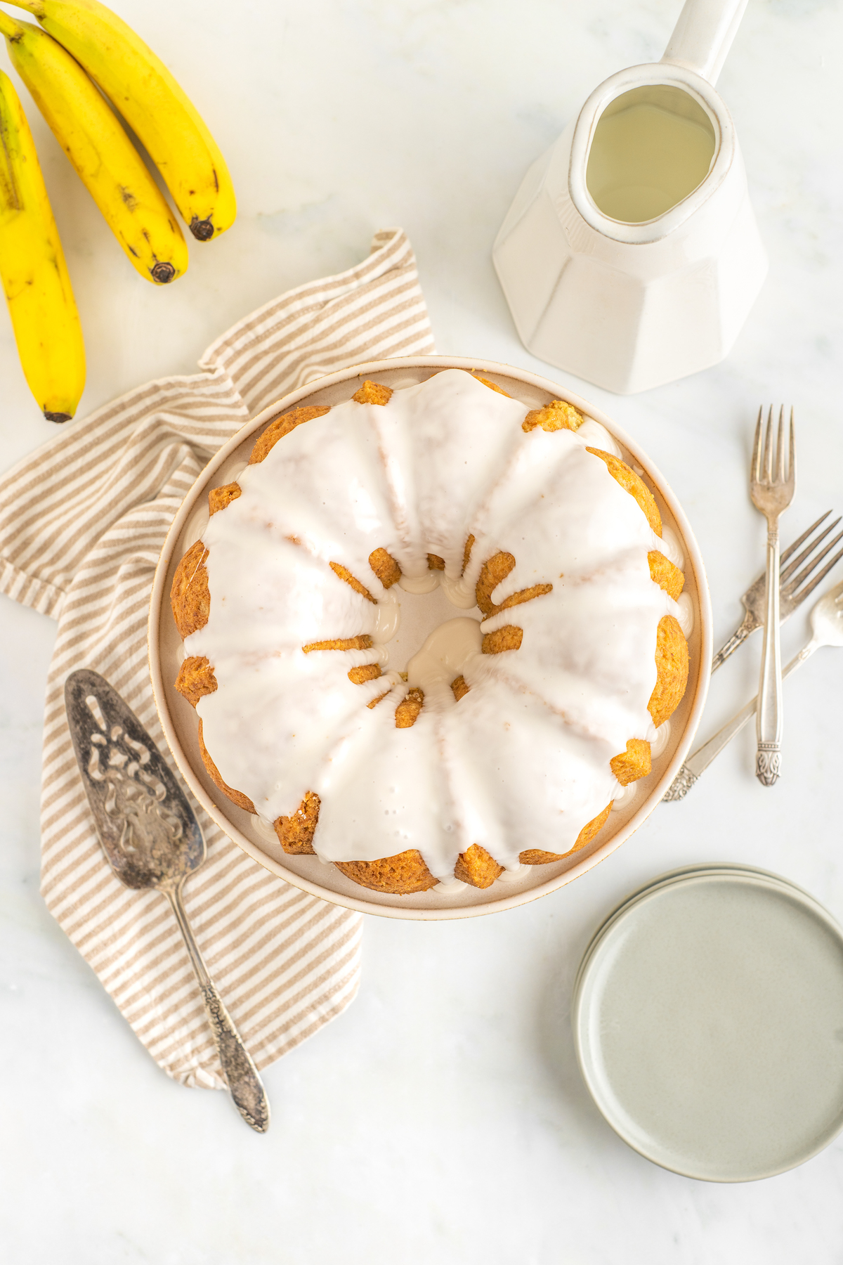 Overhead shot of a bundt cake with creamy icing.