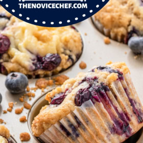 A blueberry cream cheese muffin turned on it's side in a muffin tin.