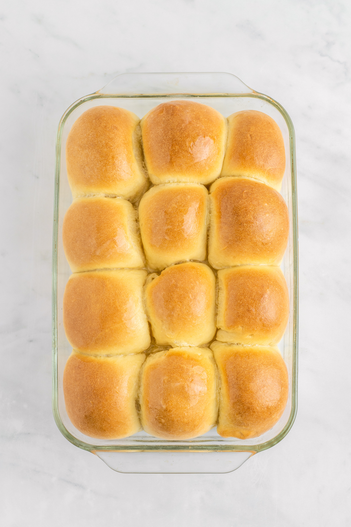 Baked dinner rolls recipe in a glass dish.