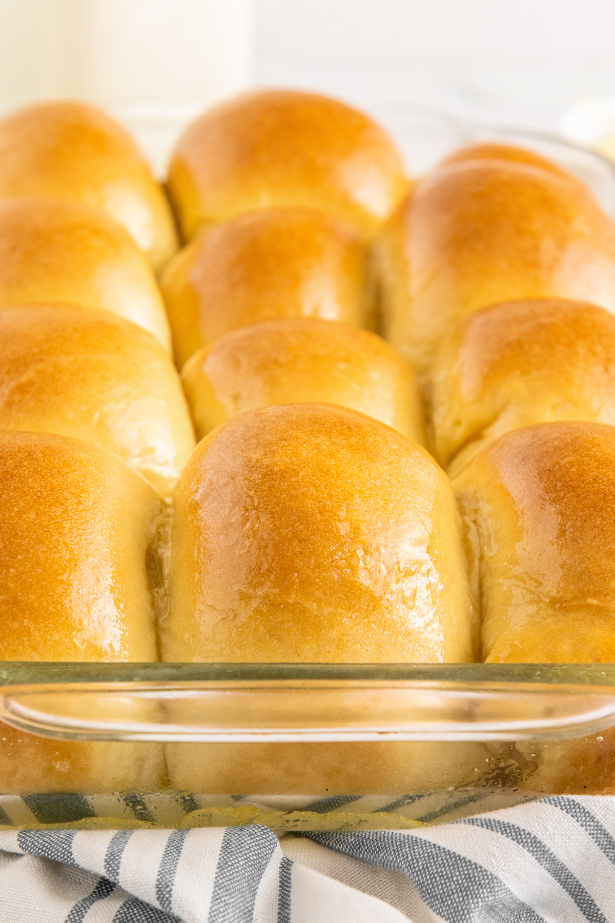 A pan of yeast rolls brushed with butter.