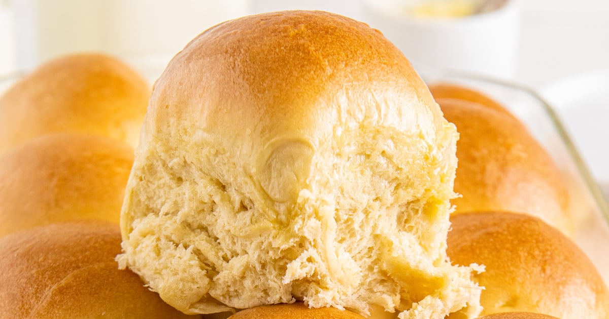 Close-up shot of a roll on top of a pan of rolls.