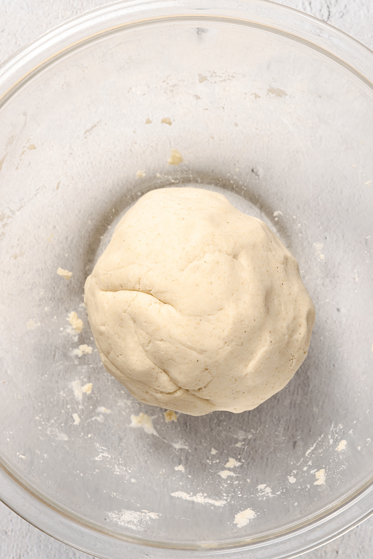 Tortilla dough rolled into a large ball.