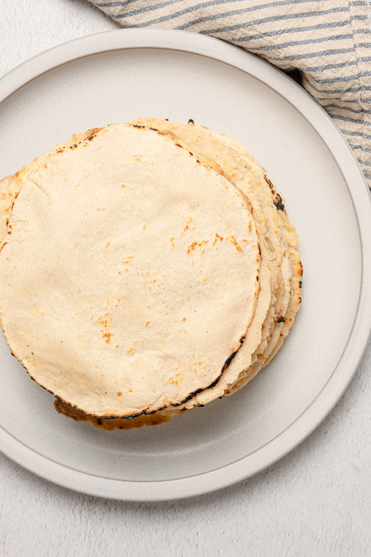 Overhead of a stack of tortillas from this authentic corn tortilla recipe.