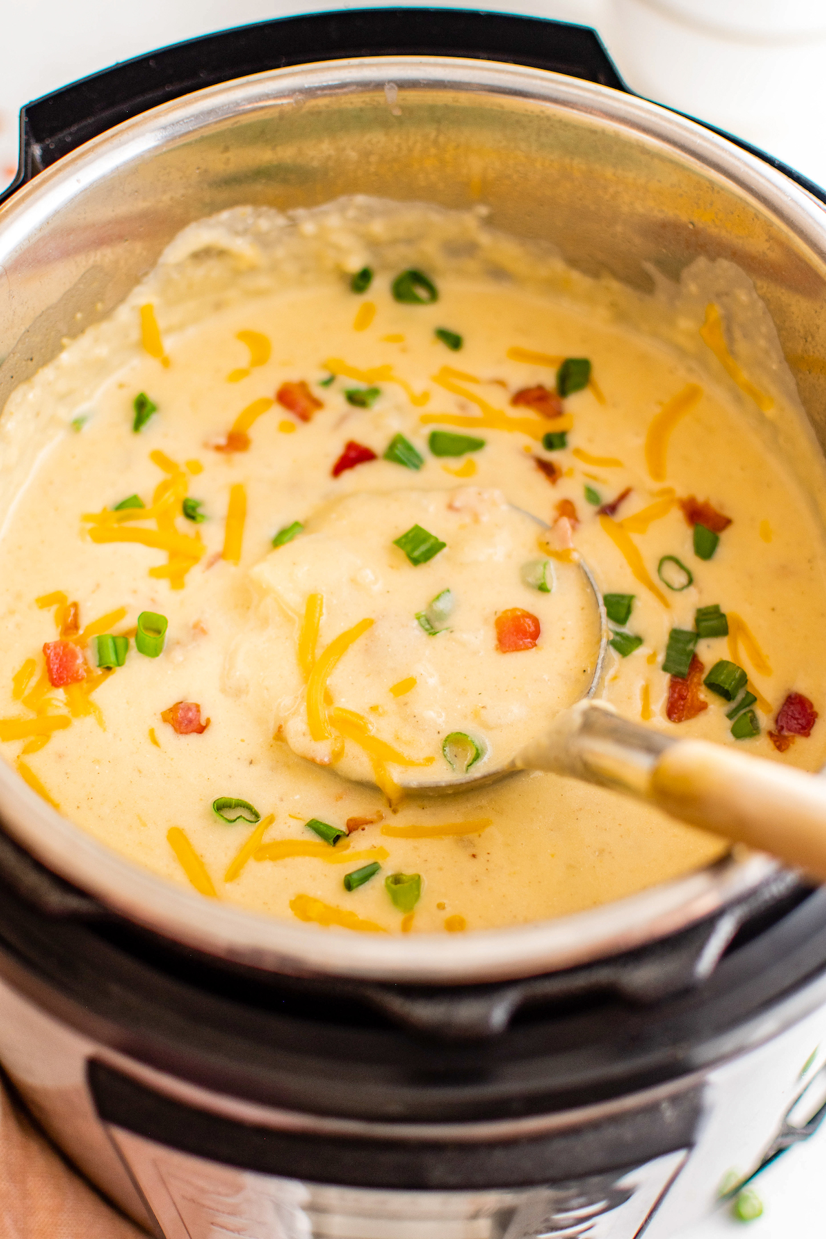 Creamy instant pot potato soup with cheese.
