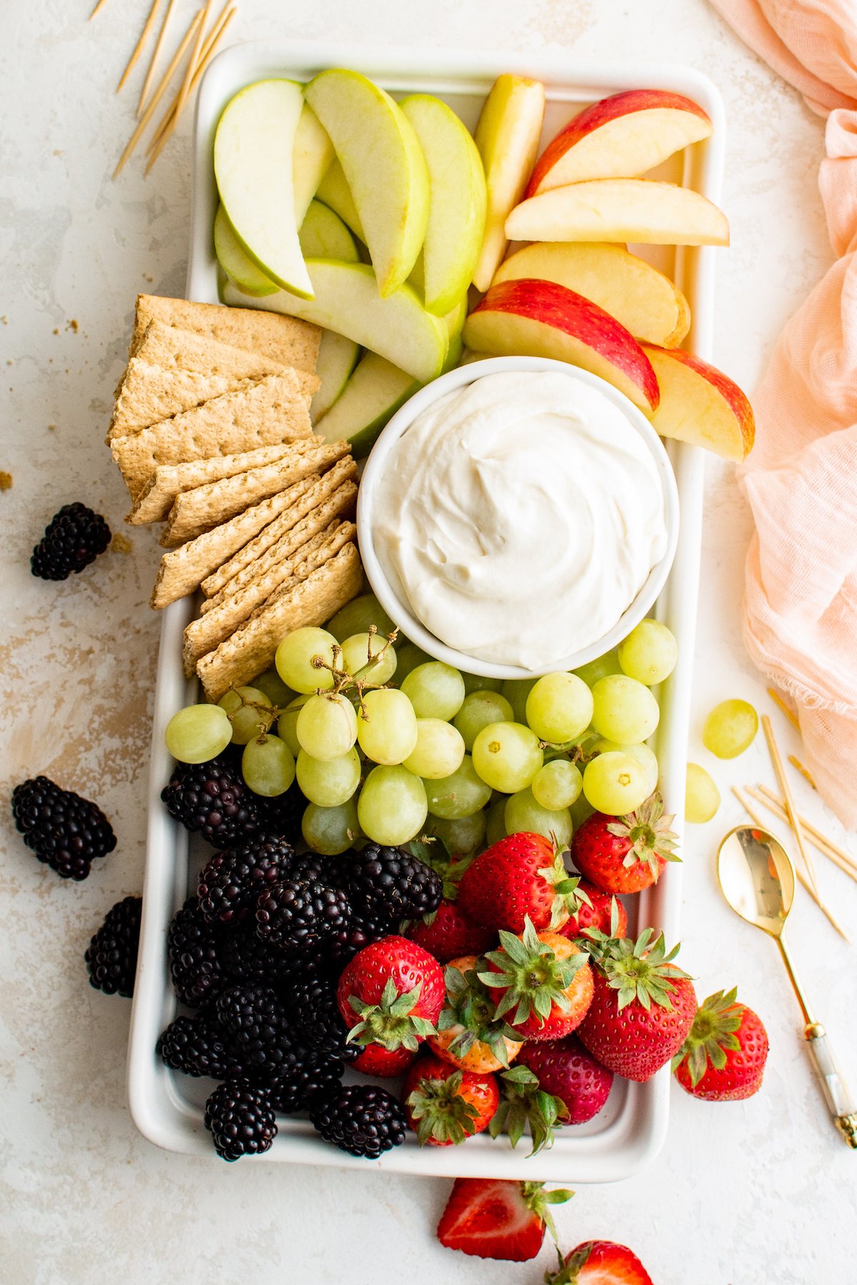 A fruit tray with creamy marshmallow fruit dip.