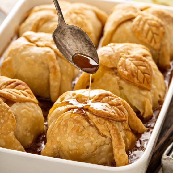 Drizzling sauce over dumplings.