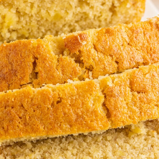 Close-up shot of pineapple banana bread sliced into one-inch-thick slices.
