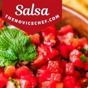 A bowl of strawberry watermelon salsa with fresh mint on top.