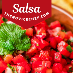 A bowl of strawberry watermelon salsa with fresh mint on top.