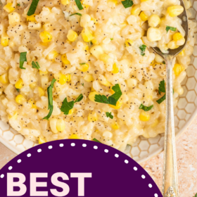 Sweet corn risotto in a bowl with fresh herbs and a spoon.