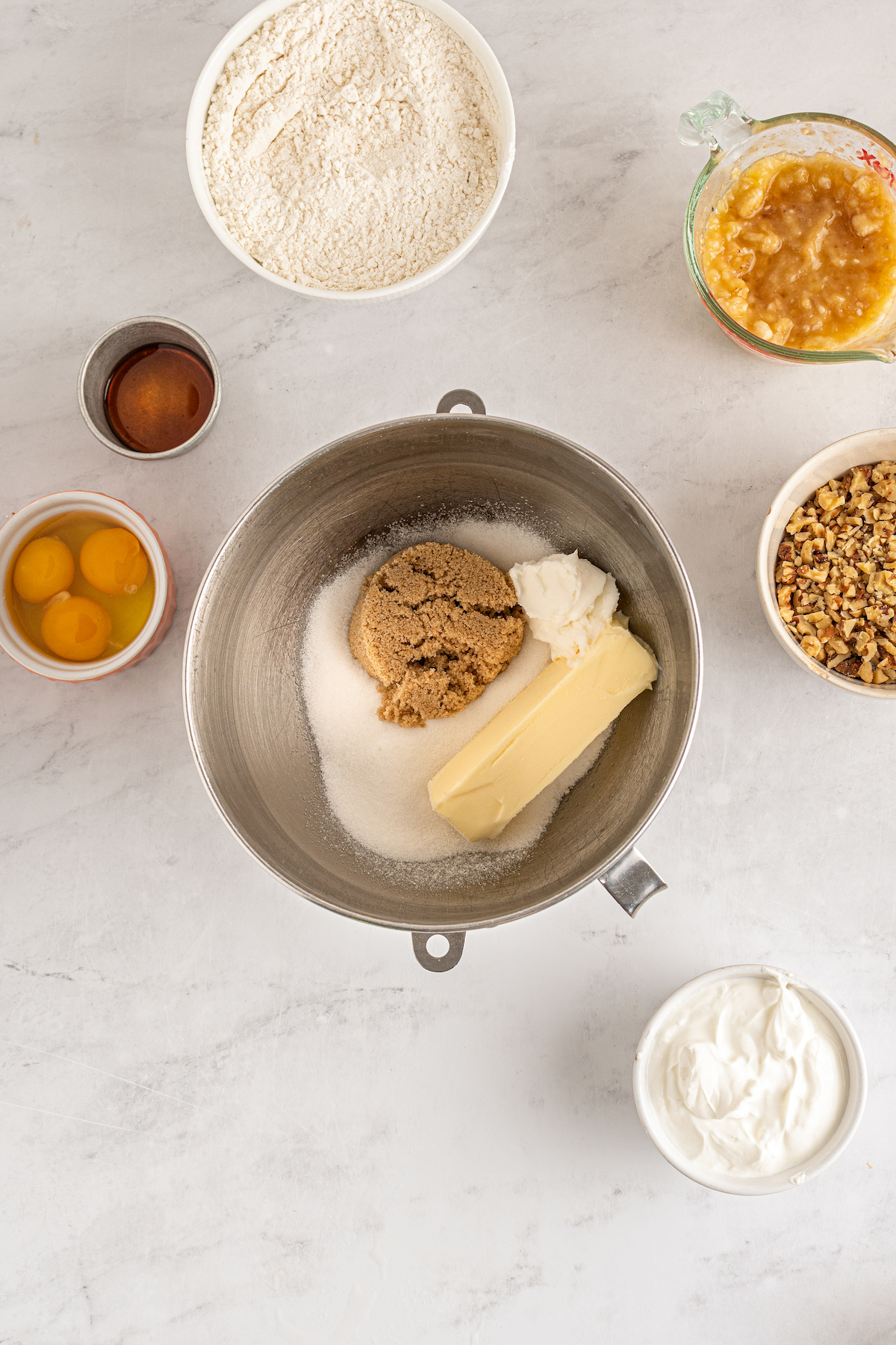 Butter, shortening, white sugar, and brown sugar in a mixing bowl.
