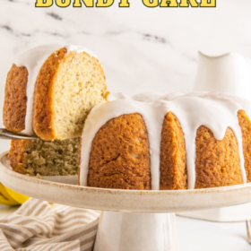 Banana bundt cake on a platter with a slice being lifted.