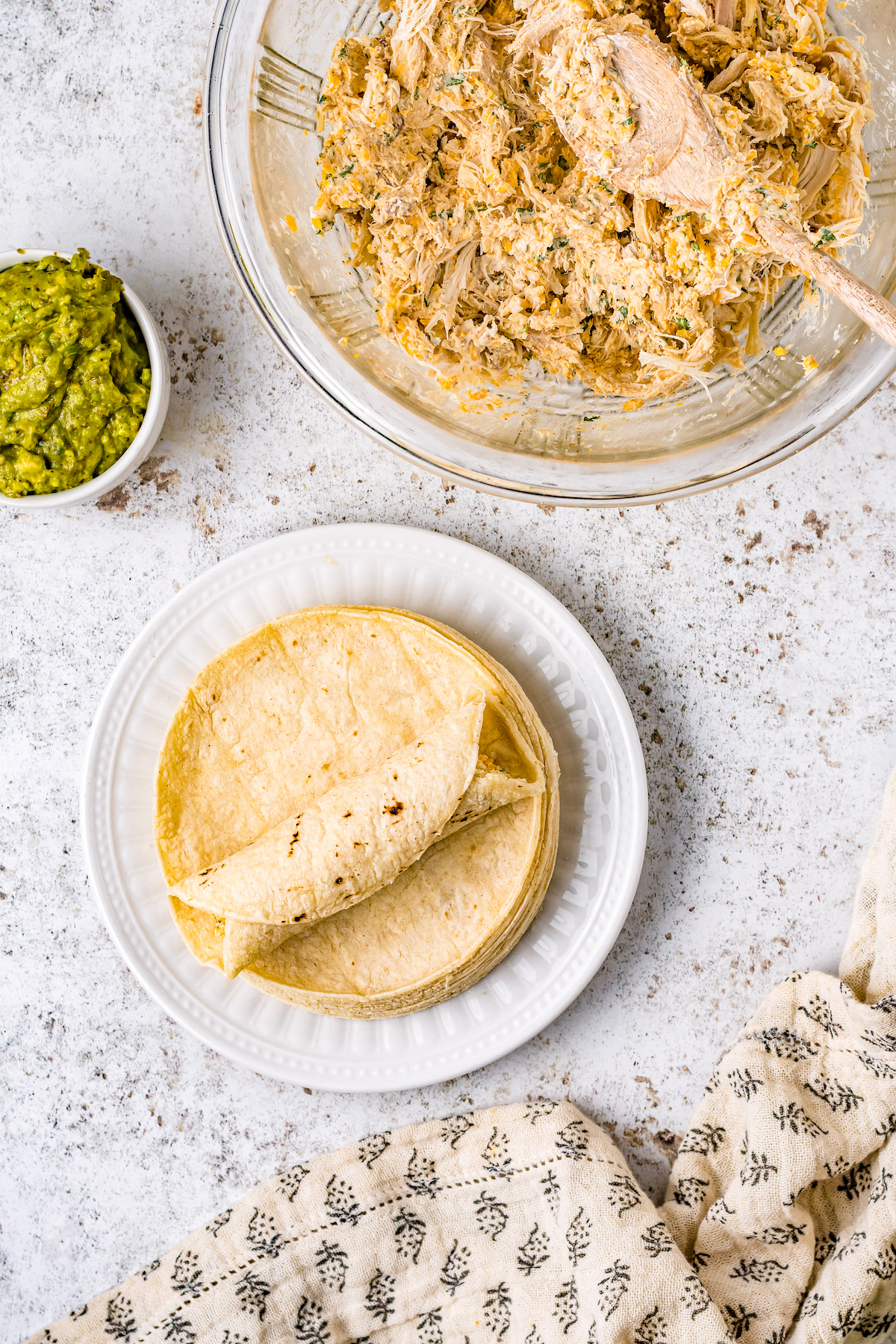 Folding the taquitos.