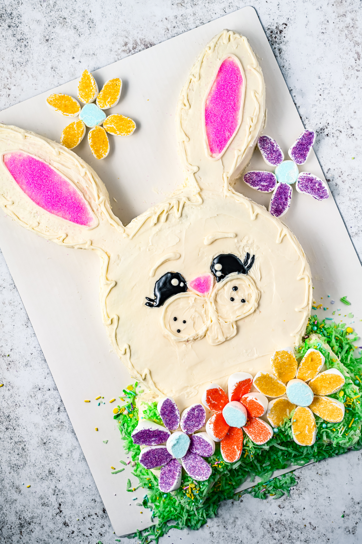 An Easeter bunny cake on a cake board.