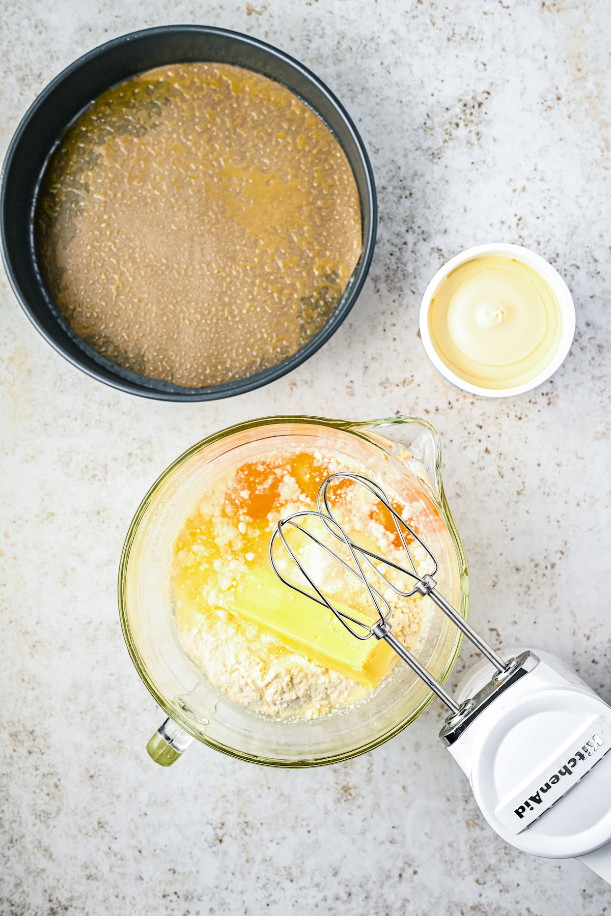 Beating cake mix and other ingredients in a mixing bowl.