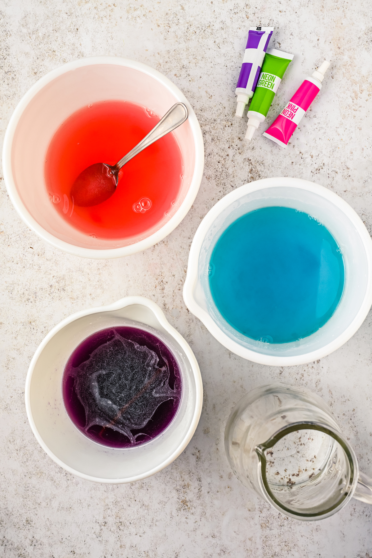 Dissolving Jello powder in mixing bowls.