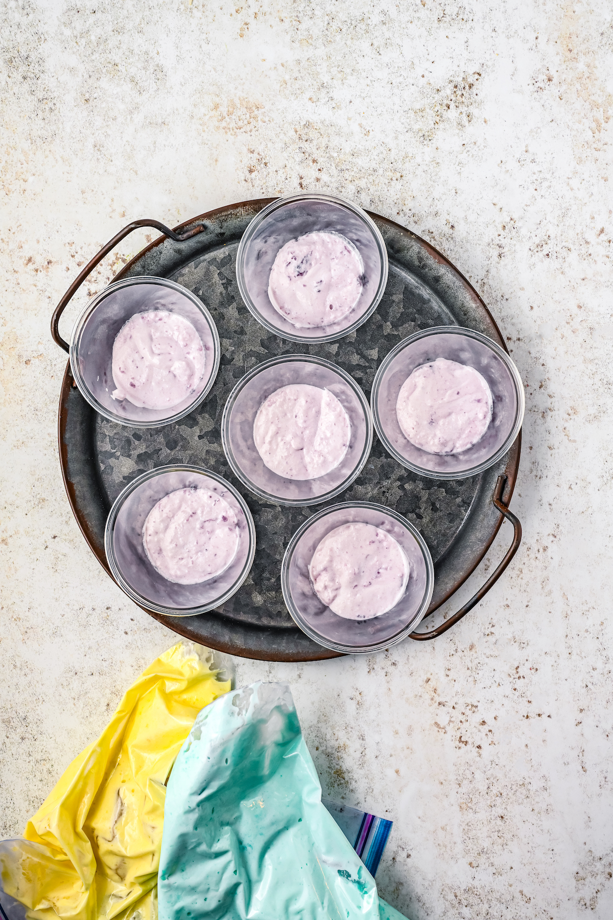 Purple creamy gelatin mixture in cups.