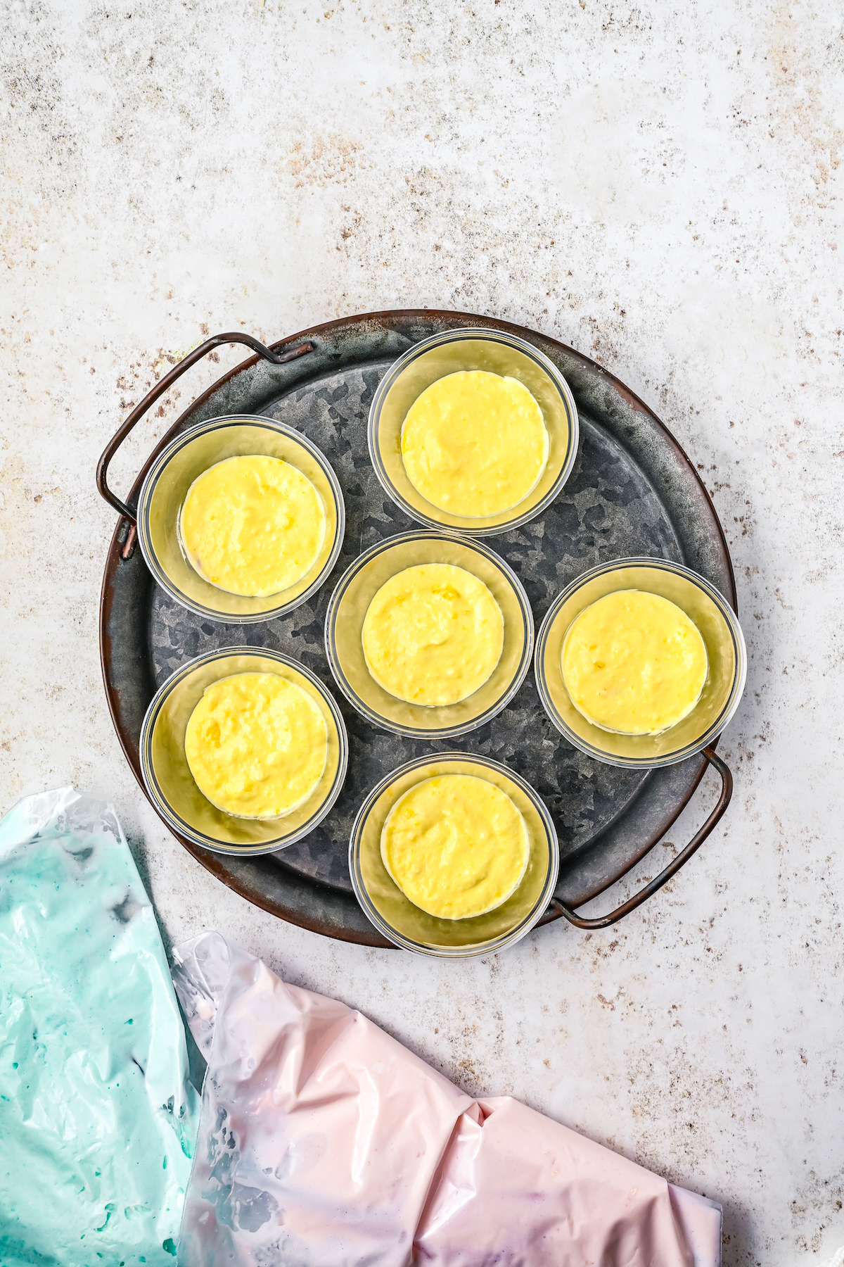 Creamy yellow Jello mixture in parfait cups.