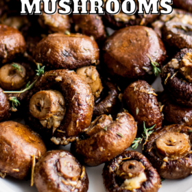 Mushrooms on a platter with herbs.