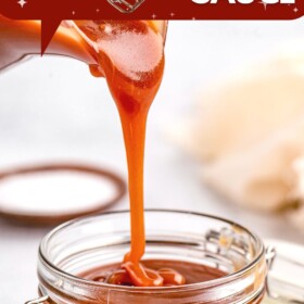 Salted caramel sauce being poured into a jar.
