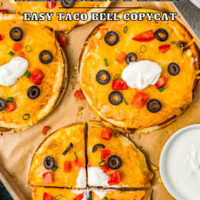 Mexican pizzas on a cookie sheet lined with parchment paper.