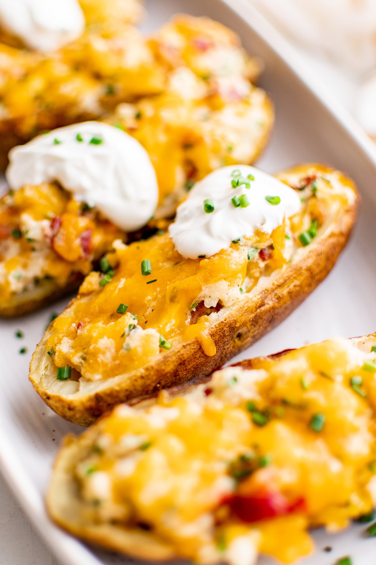 Twice baked potatoes topped with sour cream.