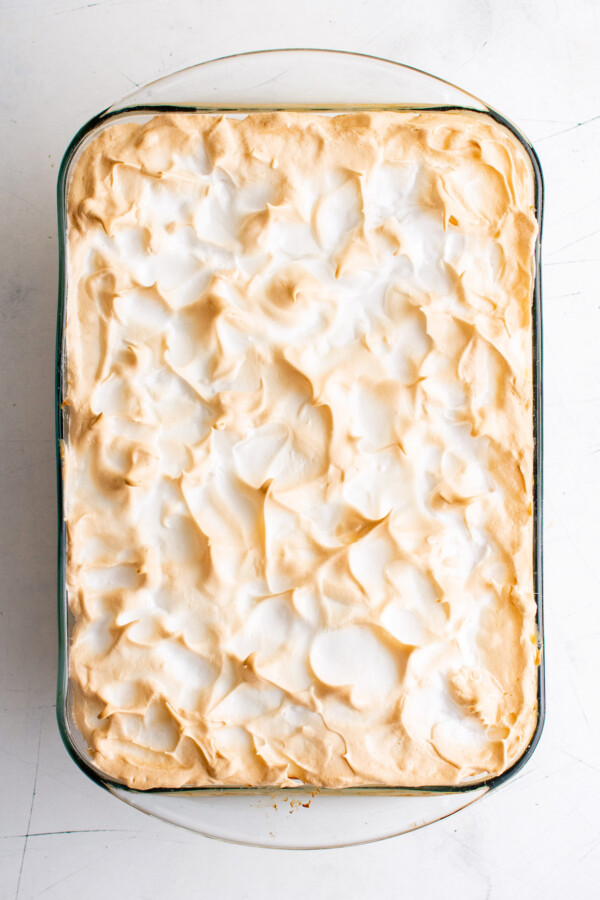 Baked pudding in the baking pan with golden meringue. 