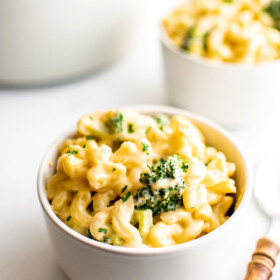 Serving macaroni and cheese in bowls.