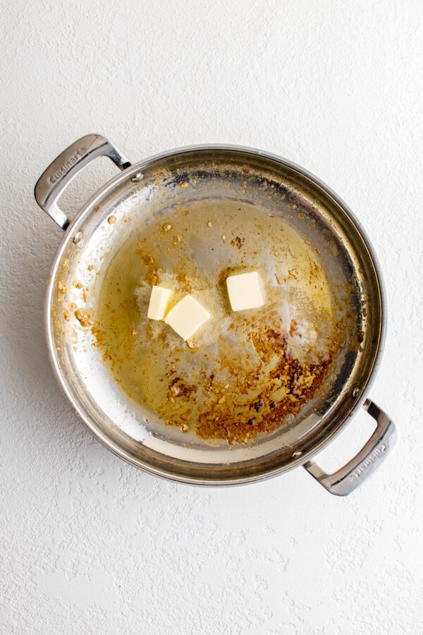 Melting the butter in the pan.