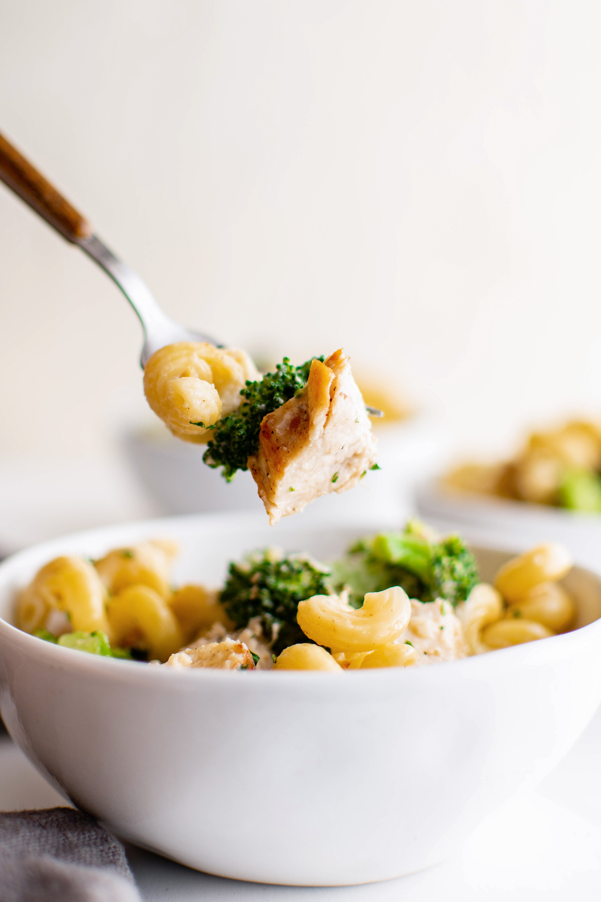 Chicken broccoli alfredo bake on a fork.