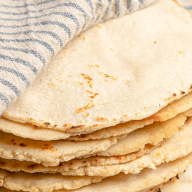 Corn tortillas stacked on top of each other.