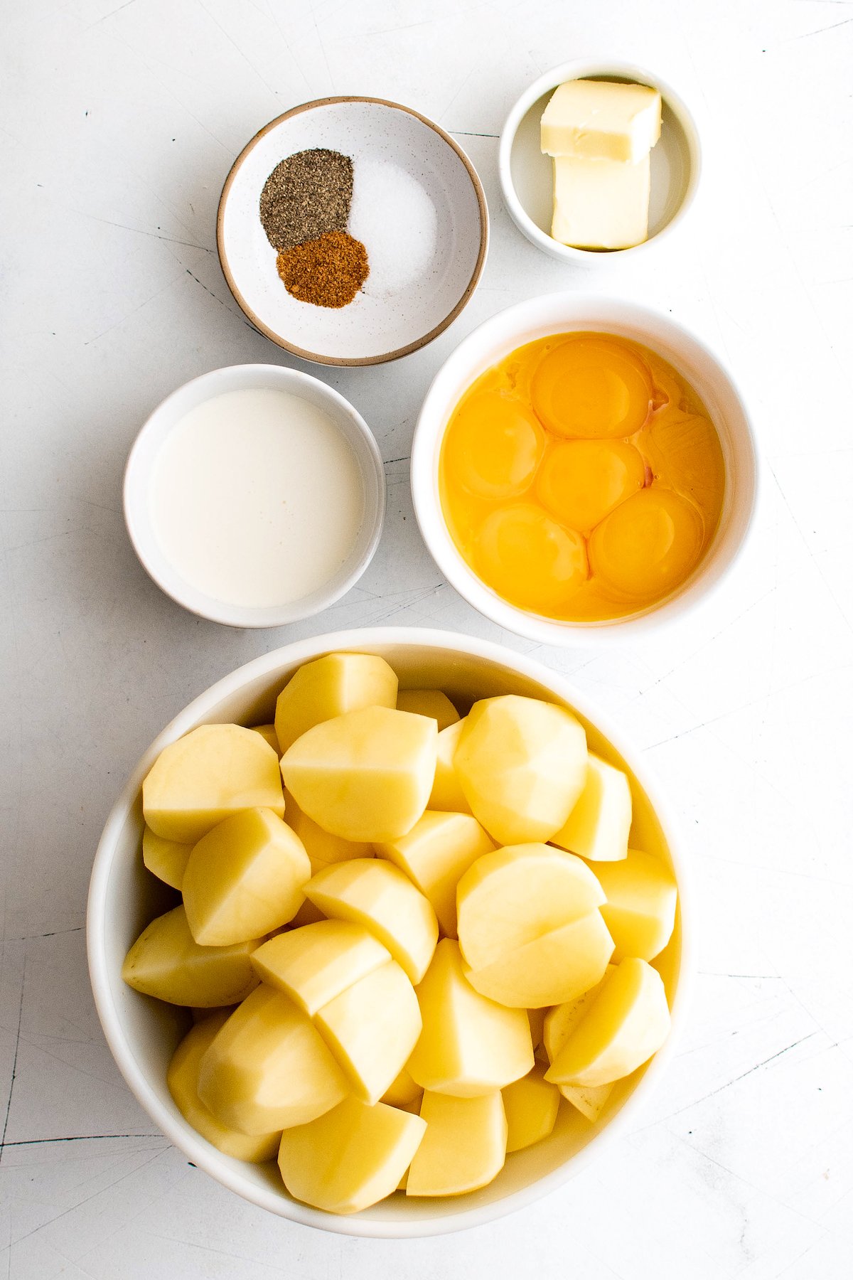 From top: Seasonings, butter, egg yolks, potatoes, cream.
