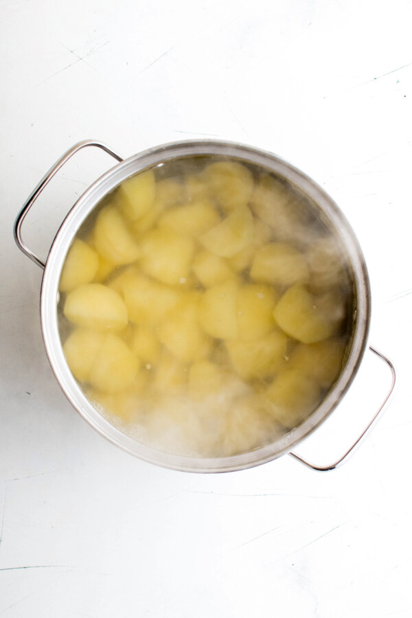 Boiling potatoes in a pot.