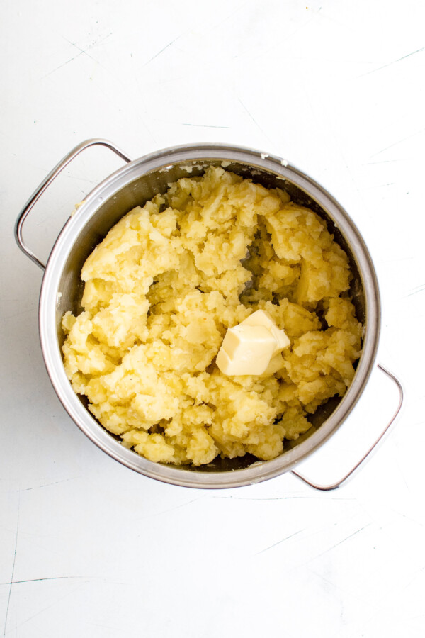 Butter added to mashed potatoes.