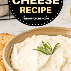 A bowl of ricotta cheese with fresh herbs on top.