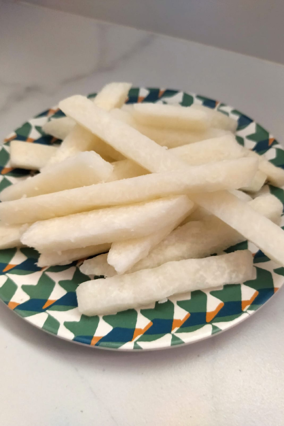 Sliced jicama on a plate.