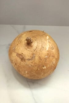 Whole unpeeled jicama.