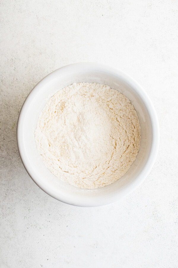 Dry baking ingredients whisked together in a mixing bowl.