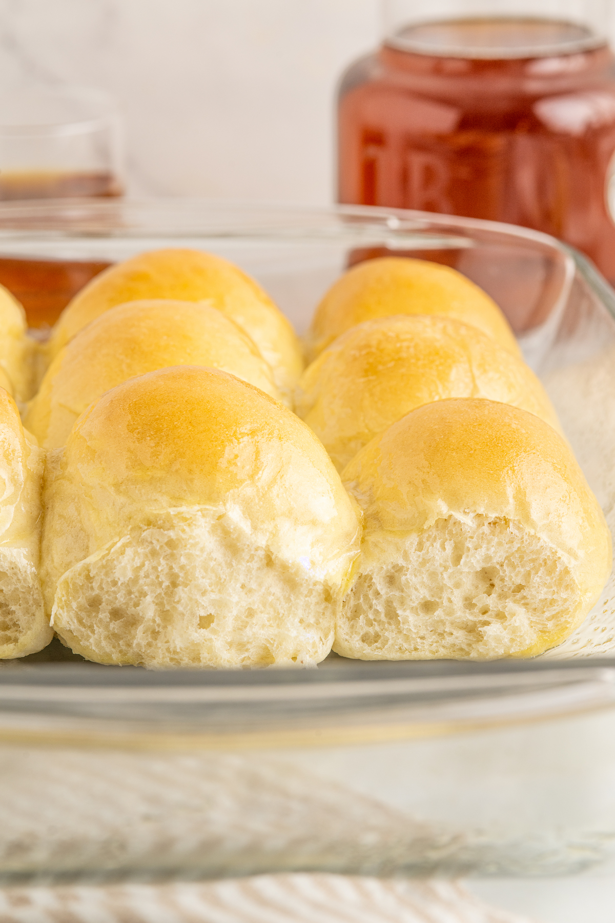 A side view of rolls, pulled apart to show the texture of the crumb.