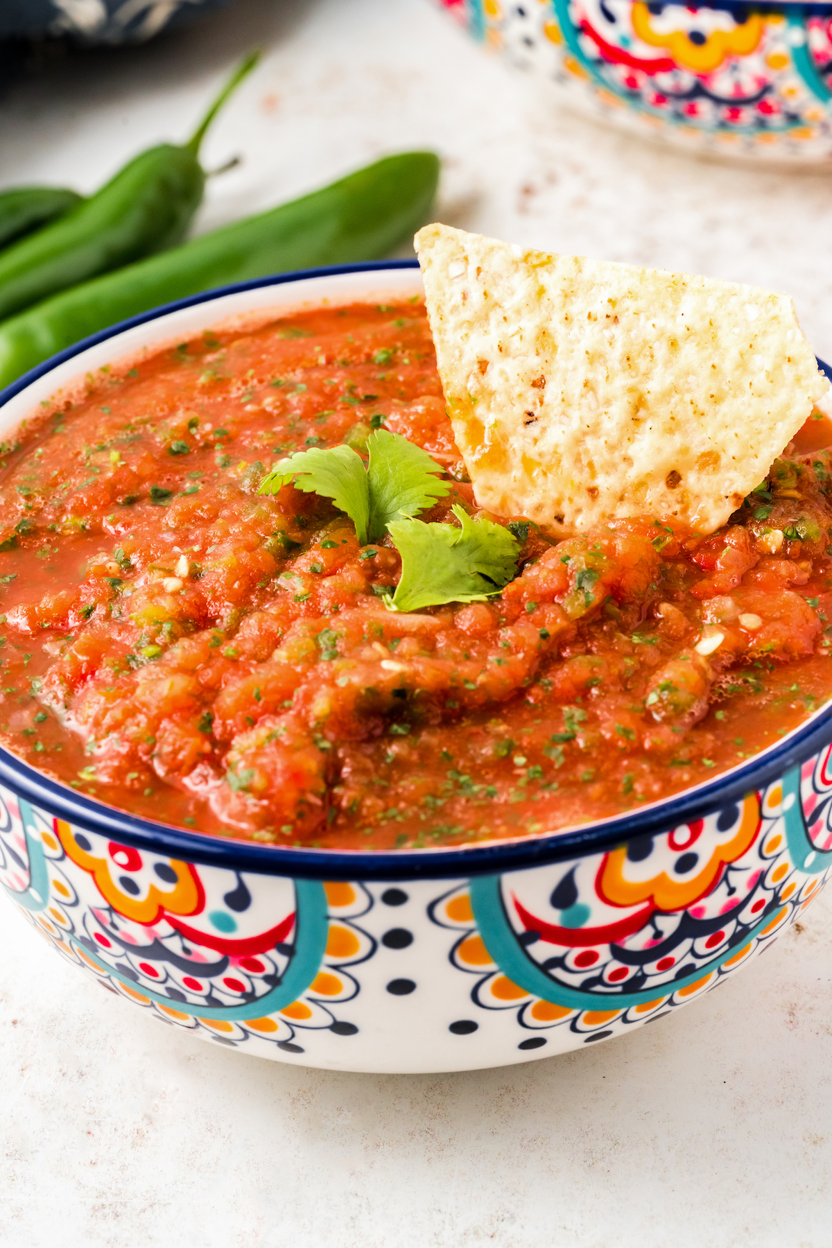 Dipping a corn chip into restaurant-style salsa. 