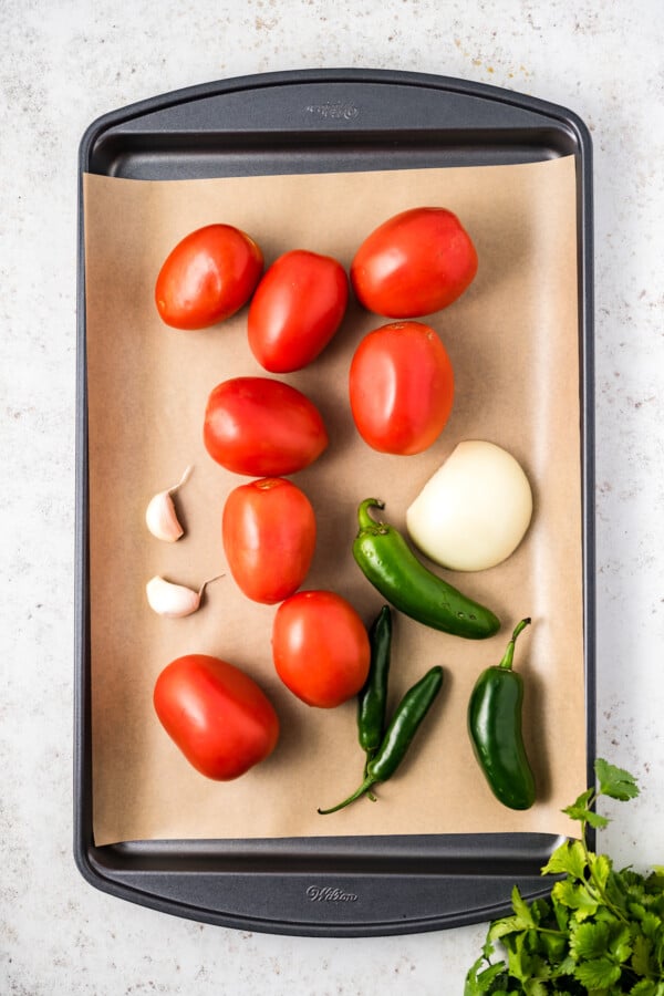 Placing the veggies in the baking sheet.