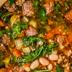 Sausage and Kale Soup with White Beans in a bowl.